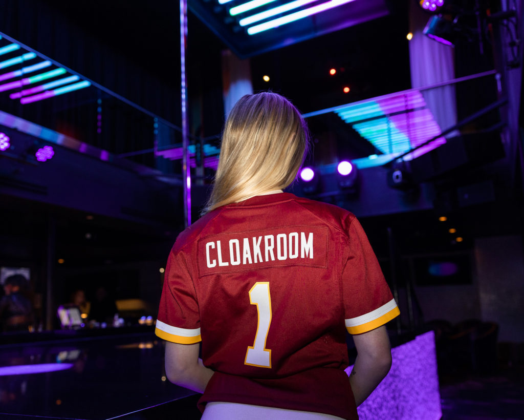 Cloakroom exotic dancer in Commanders Redskins jersey in Washington DC for sportsbook sportsbetting