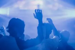 a crowd of people at a concert with their hands in the air Club in Washington DC